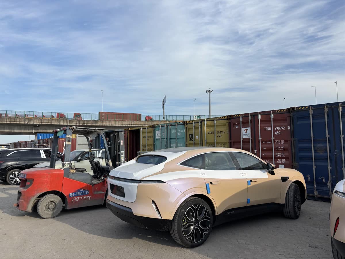 A vehicle being positioned at a container yard before loading